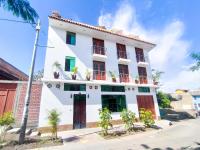 a white building with plants in front of it at Sumaq Wari Hotel in Ayacucho
