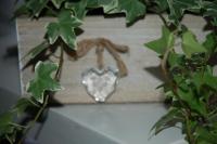 a heart ornament on a shelf with a plant at Hôtel de L&#39;Avenue in Saintes