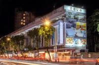 a building on a city street at night at CU Hotel Taipei in Taipei