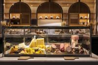 een vitrine gevuld met veel verschillende soorten voedsel bij Stayso The House Hotel in Istanbul