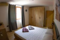 Postel nebo postele na pokoji v ubytování Port Natura Apartment