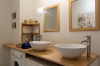 a bathroom with two white bowls on a counter at Appart cosy(4pers)PARKING CLIM Terrasse Vélodrome in Marseille