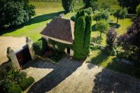 an aerial view of a house with trees and bushes at Studio indépendant ,Manoir de la Vove,Perche in Corbon