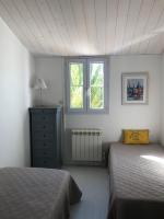 Posteľ alebo postele v izbe v ubytovaní Le Phare - Gîte de mer Boyardville