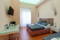 Posteľ alebo postele v izbe v ubytovaní Aurora Garden Lodging - Rooms & Apartment