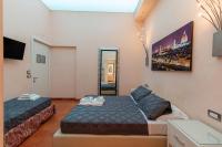Posteľ alebo postele v izbe v ubytovaní Aurora Garden Lodging - Rooms & Apartment