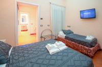 Posteľ alebo postele v izbe v ubytovaní Aurora Garden Lodging - Rooms & Apartment