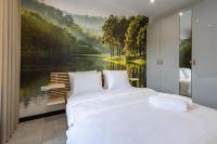 Łóżko lub łóżka w pokoju w obiekcie Apartament Przystań Iława Green
