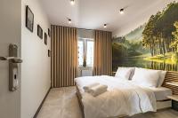 Łóżko lub łóżka w pokoju w obiekcie Apartament Przystań Iława Green