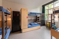 a dorm room with bunk beds in it at Stayokay Hostel Amsterdam Vondelpark in Amsterdam