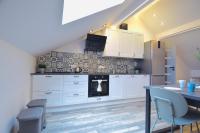 Kuchyňa alebo kuchynka v ubytovaní Apartamenty Żołnierska 31 - Apartament nr 1