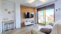 TV a/nebo společenská místnost v ubytování OleHolidays 233 Romana Playa vistas al mar