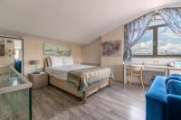 A bed or beds in a room at Elanaz Hotel