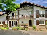 a house with a dog in front of it at Amama Baita in Urrugne