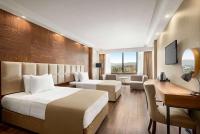 Postel nebo postele na pokoji v ubytování Ramada Plaza by Wyndham Samsun