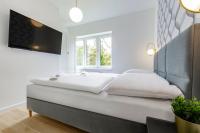 Posteľ alebo postele v izbe v ubytovaní VacationClub – Prusa 2 Apartament 3B