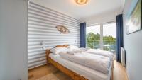 Posteľ alebo postele v izbe v ubytovaní Apartamenty Sun & Snow Let's Sea Baltic Park