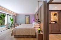 a hotel room with a bed and a balcony at Four Seasons Hotel in Limassol