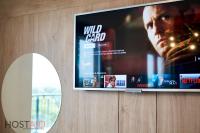 A television and/or entertainment centre at ELLBy Apartman - PENTHOUSE - hostAID