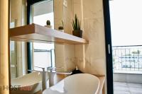 A bathroom at ELLBy Apartman - PENTHOUSE - hostAID