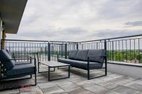 A balcony or terrace at ELLBy Apartman - PENTHOUSE - hostAID