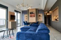 A television and/or entertainment centre at ELLBy Apartman - PENTHOUSE - hostAID