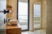 A bathroom at ELLBy Apartman - PENTHOUSE - hostAID