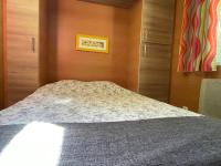 Łóżko lub łóżka w pokoju w obiekcie Les Chalets de Labeaume