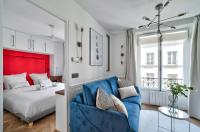 Łóżko lub łóżka w pokoju w obiekcie Sublime appartement au coeur de Paris
