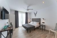 A bed or beds in a room at La Posada del Teatro H Boutique Parking Gratis