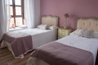 A bed or beds in a room at Luz del Tajo