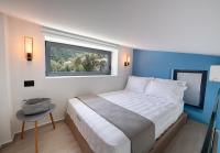 Posteľ alebo postele v izbe v ubytovaní RIZOMATA LUXURY VILLAS