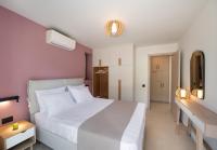 Posteľ alebo postele v izbe v ubytovaní RIZOMATA LUXURY VILLAS