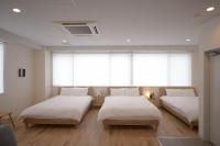 RIVER VILLAS HIROSHIMAにあるベッド