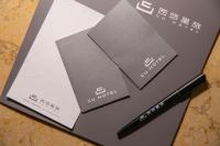 a black pen sitting on top of a notebook at CU Hotel Taipei in Taipei