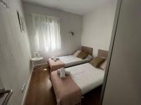 A bed or beds in a room at Estupendo apartamento en Estación-Centro, WIFI, Agua por Osmosis