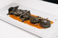 a plate of frogs on a white plate at Hotel Minerva in Arezzo