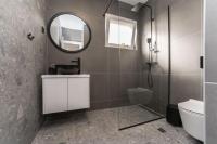 a bathroom with a sink and a mirror at Luxury D Apartments in Bibinje
