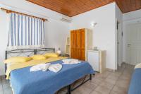 Posteľ alebo postele v izbe v ubytovaní Apollon Rooms