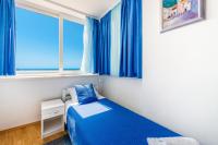 Posteľ alebo postele v izbe v ubytovaní Blue Harmony Sea View Apartment
