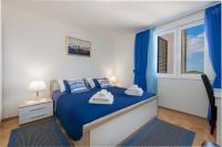 Posteľ alebo postele v izbe v ubytovaní Blue Harmony Sea View Apartment