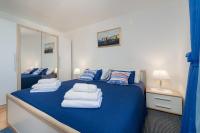 Posteľ alebo postele v izbe v ubytovaní Blue Harmony Sea View Apartment