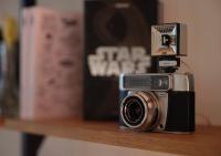 a camera sitting on a shelf next to a book at Maison Juste in Marseille