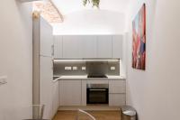 A kitchen or kitchenette at JOIVY Ideal Flat near Aquarium