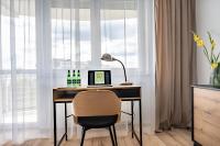 Televízia a/alebo spoločenská miestnosť v ubytovaní Grelewicz Apartments- MyPleasure