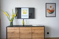 Televízia a/alebo spoločenská miestnosť v ubytovaní Grelewicz Apartments- MyPleasure