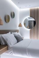 Postel nebo postele na pokoji v ubytování Ammos Luxury Apartments