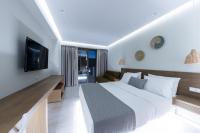 Postel nebo postele na pokoji v ubytování Ammos Luxury Apartments