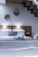 Postel nebo postele na pokoji v ubytování Ammos Luxury Apartments