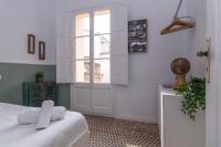 Posteľ alebo postele v izbe v ubytovaní 1840 Apartments Sitges by Suma Hotels